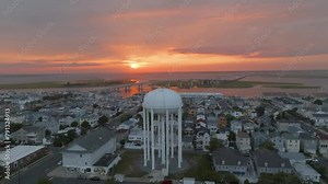 Gorgeous sunset with the water tower and 9th St bridge in the shot in Ocean City, New Jersey.