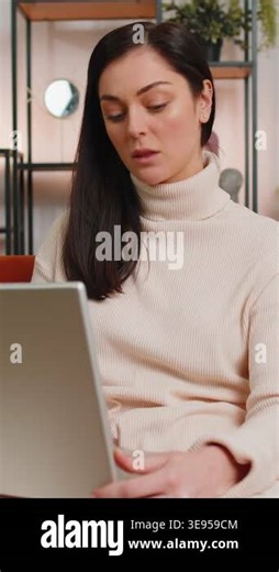 Young woman sitting on couch closing laptop after finishing work in living room at home couch. Brunette lady freelancer working online, remote job. E-learning, browsing internet on notebook computer Stock Video Footage - Alamy