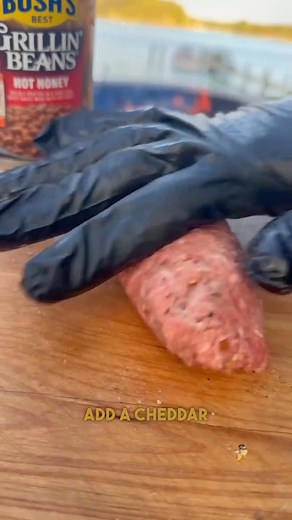 #BushsBeansPartner CHEESEBURGER GLIZZYS 🍔🌭 @bushsbeans teamed up with @mikeshothoney, and they are bound to take your tailgate spread to the next level, trust.👀 I made these Cheeseburger Glizzys — stuffed a cheese stick inside seasoned ground beef, shaped it like a hot dog, and threw it on the grill ‘til it was juicy and charred just right.🔥 Served it up with Bush’s Grillin’ Beans with Mike’s Hot Honey on the side (sweet heat combo crazyyy 😮‍💨) — then hit the glizzys with ketchup, mustard,