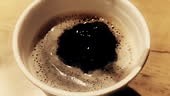 coffee drop falling in super slow motion inside of cup of espresso...