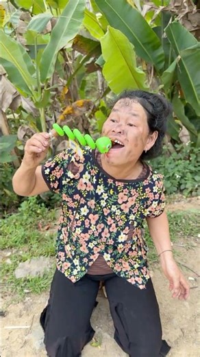Grandma bought strange toy candies that the girl didn't know how to eat, so she helped her