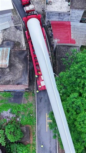 So this is how wind turbine blades make their way through rural villages! #chinawonders #technology #innovation #infrastructure #development #windturbine #wind Credit to yifanchepin3 on Douyin. | China wonders