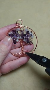 Making a tree-of-life pendant with amethyst and other purple beads. 24 gauge branches and 16 gauge hoop. | Camille Sharon
