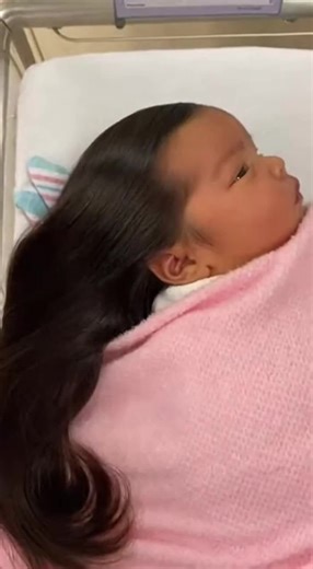 Newborn Baby with Long Hair: A Heartwarming Moment
