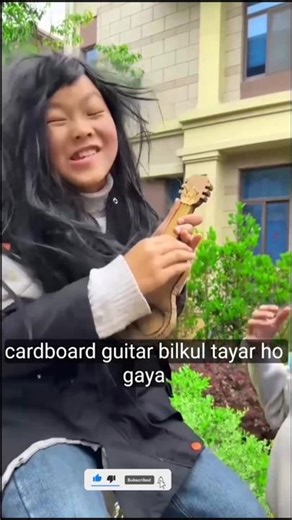 This girl made a guitar out of garbage 🎸🤯~#trending #shortsfeed #shorts #ytshorts #gitar /chinese...