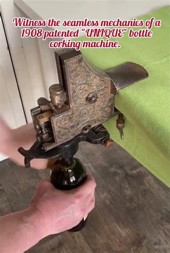 Witness the seamless mechanics of a 1908 patented "UNIQUE" bottle corking machine.