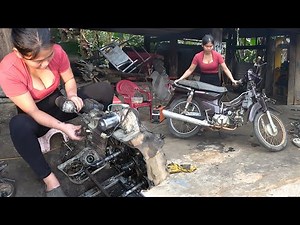 Talented mechanic girl repairs and maintains a motorbike that was swept away by a massive flood