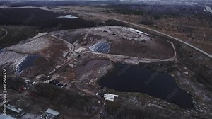 Quarry operations rely on rock dumps and reservoirs. Quarry works to extract diverse mineral resources destined for upcoming construction projects