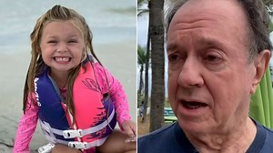 911 call reveals effort to save girl buried in sand hole at Florida beach