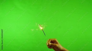Slow motion firework burning for celebration on green screen background