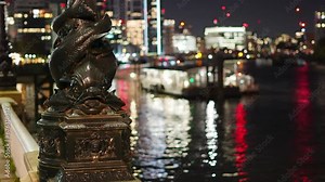 Thames embankment dolphin lamp post at night. Decorative victorian lamp post seen along much of the Thames embankment.