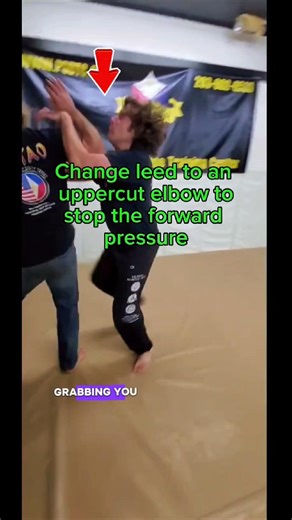 Teaching the class how to blend footwork & simultaneously striking to redirect incoming force.