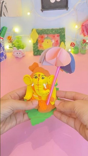 You can make a beautiful rainbow umbrella with round colour paper and straws.Try it