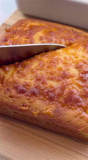 Discover the secret to making the most delicious, cheesy cornbread ever! This quick and easy recipe is perfect for beginners and guaranteed to impress. Watch how to create this comfort food classic with a bubbly, melted cheese topping. Perfect for a side dish or a snack! #cornbread #cheesy #baking #easyrecipe #comfortfood | MealDelights