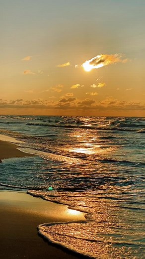 Serene Sunset Beach Scene with Gentle Ocean Waves