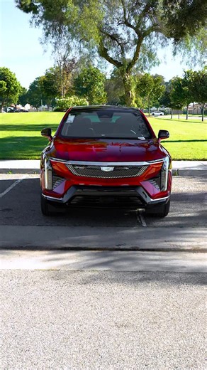 Head-turning from the very first glance. The 2026 OPTIQ pairs a low roofline with a deeply sloped windshield to create a sense of motion and drama, even at a standstill, so every drive feels like an arrival. See it shine in person at your local SoCal Cadillac dealer. 🎥: 2026 OPTIQ Luxury in Radiant Red Tintcoat | Southern California Cadillac