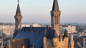 Aachener Rathaus with fortifications and spires, and architectures in the background in Germany