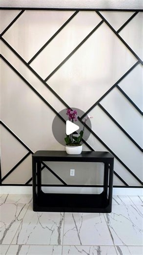 The Boardroom® Accent Walls on Instagram: "Stepping into sophistication! 🖤✨ Check out this stunning entry wall featuring a two-toned geometrical design. We used Sherwin-Williams Tricorn Black on the front of the boards, giving the design that perfect pop. Elevate your space with a touch of elegance and creativity. #AccentWall #EntrywayGoals #HomeDesign #SherwinWilliams #GeometricDesign #InteriorDesign #HomeInspiration #ModernLiving #DIYHome #WallDecor #TricornBlack #BoardroomAccentWalls #creati