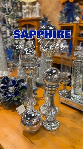 A bold twist on holiday elegance with our ✨ Sapphire & Silver Collection ✨ This stunning theme trades traditional red for deep blue and shimmering silver, creating a dramatic, modern look that’s delightfully glamorous. What we love about this collection: 💙 Metallic shine throughout 💙 Silver giftware that sparkles against dark blue ornaments 💙 Reflective textures and glittering garlands that feel icy and luxurious 💙 A holiday look that’s sleek, bold, and refreshingly unexpected Discover this 