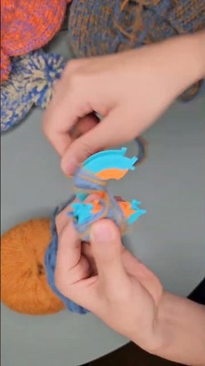 Make a fluffy yarn pom pom