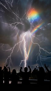 THE STORM LIT UP A PRISM OF COLOR ⚡🌈 Lightning was already tearing through the clouds .. then the rain hit at just the right angle, and suddenly beams of rainbow light started falling from the storm like glowing curtains. What’s happening in scenes like this is a wild mix of heavy rain shafts, lightning backlighting the clouds, and sunlight sneaking through gaps near the horizon. The droplets bend and scatter the light into color, while the dark storm behind them makes the rainbows look almost 