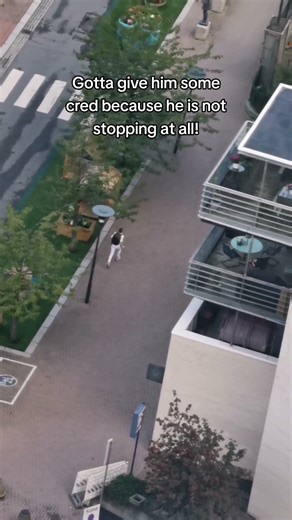 Crane operator films someone running to catch the metro on time!