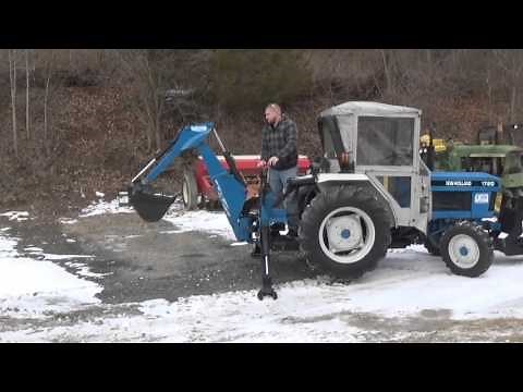 NEW HOLLAND 1720 SSS 4x4 COMPACT TRACTOR WITH CAB, BACKHOE, AND V-PLOW