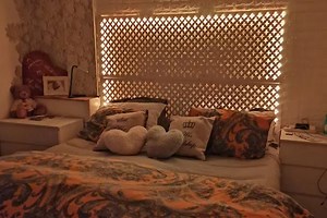 Woman shows off £60 light-up bed her husband made using cheap radiator boards