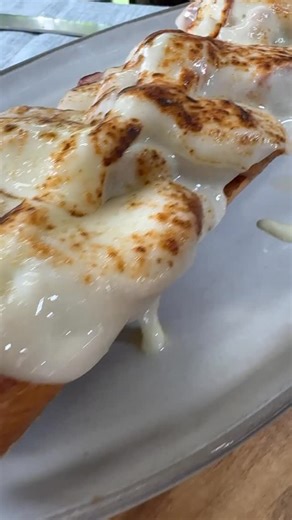 Scott Gregory Thomas on Instagram: "Reverse seared pork tenderloin sando topped with provel cheese melted with a blow torch. Toasted buns (who doesn’t love toasty buns) and some garlic aioli round out this epic sammich"