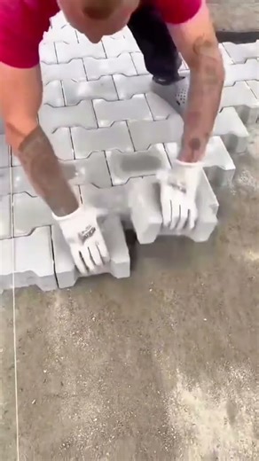 Interlocking Pavers Installation: Hand-Laying Hexagonal Concrete Blocks for a Patio