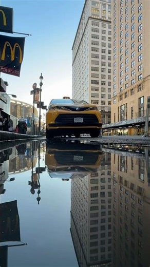 How a reflection photo is made with a puddle. Manhattan, NYC