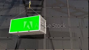 Container with Mock Up Green Screen. A container is being moved along the wall of containers at the seaport. The camera is positioned in front. Chroma key Display with Isolated Placeholder. 3D render