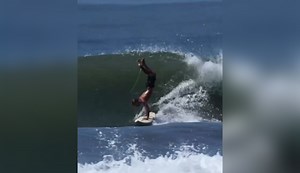 Jack Coleman Films Taylor Watling Doing a Handstand on a Shortboard