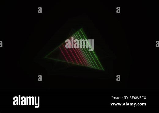 A triangular prism refracts light, creating a spectrum of colors against a black background. Abstract geometric light effect Stock Video Footage - Alamy