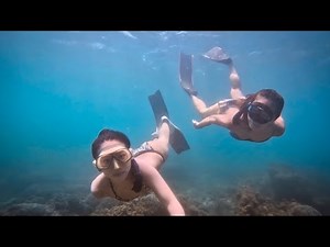 Two Freediving Girls' Fun Dive Together Underwater