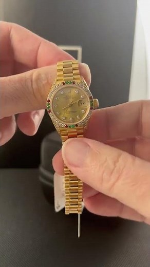 Rolex President Datejust Yellow Gold Diamond Ruby Emerald Watch 69038 Review | SwissWatchExpo