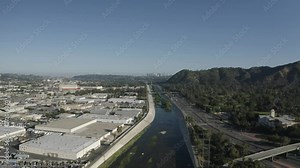 Los Angeles, California USA, Aerial View of Traffic on Golden State Interstate-5 Freeway by LA River and Glendale and Griffith Park Neighborhood During Covid-19 Pandemic Outbreak, Drone Shot