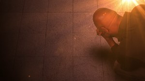 Kneeling In Prayer Bright Light Stock Motion Graphics SBV-300094292 - Storyblocks