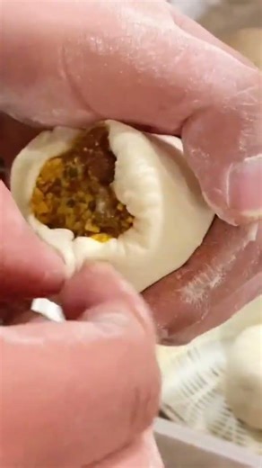 making dim sum with minced meat filling covered with flour dough skin