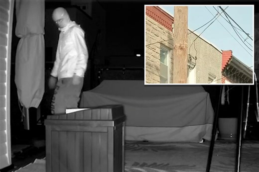 Masked man spotted lurking on top of Philadelphia home in dead of night