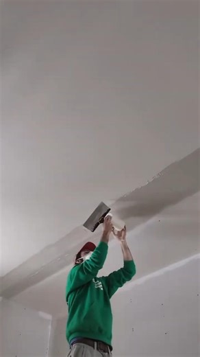 Taping this awful transition between new drywall and the existing ceiling; with 6" Fiba-fuse