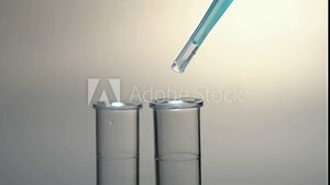Blue liquid reagent drop from pipette in test tube, pharmacology, medicines research and development in laboratory, covid-19 test.