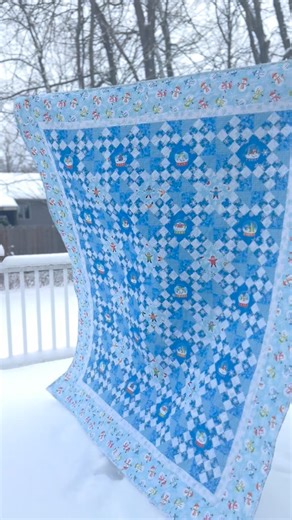 Kaye Collins 🧵 HQ Educator on Instagram: "The snow globe quilt is finished and will be one of the choices for my family Christmas Quilt Raffle. DON’T ask for the pattern… it is a panel meant for quilt shop owners but I found it at Marden’s which is a salvage resale store. No piecing at all!!!! I added some beautiful snowflake stitching. And it was snowing like crazy until I got the binding on and then it stopped. 🙄 #cheaterpanel #longarmquilting #snowyday"