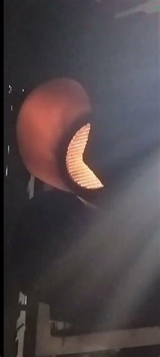 Another Flashing Amber Peek Traffic light At Night Time.