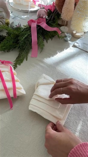 How to fold a Napkin like a 🎄 Tree from @debtrette • fold napkin into a half fold napkin into a square bring the corners in (stacking) flip over bring each corner onto the middle fold the triangles upward tucking in after the first! #hosting #tablescape #tabledecor #christmasdecor #christmasideas #dinnerparty #hostingideas #christmastable #easydiy #diyidea | Elegantcreator.com
