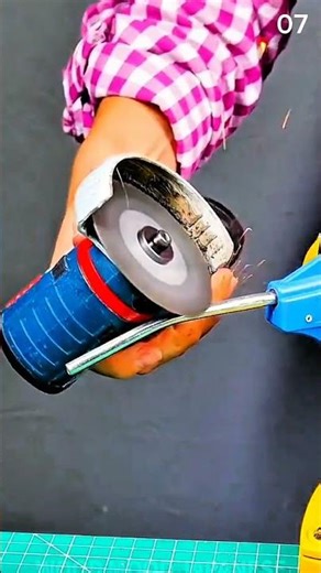 Cutting bent metal rod using angle grinder tool