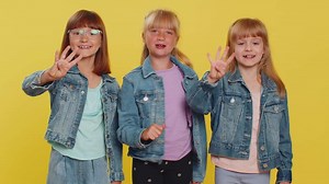 Teenage girls counting in reverse order from five to one, countdown to holiday birthday celebration