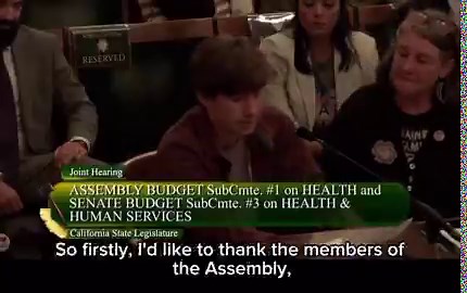 🚨HEARTBREAKING: This is the sacrificial lamb.A 16-year-old girl with a wispy mustache and flannel shirt describe overcoming anorexia but still hating her female body.“As I went through puberty, my body became something alien to me — while my male classmates’ bodies is something I wanted."This was after her mother, Rhaetia Hanscum from Rainbow Families Actiom, actually cried as she described Kaiser Permanente declining her daughter’s double mastectomy (“top surgery”) due to pressure from the Fed