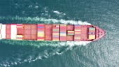 Top view of a cargo ship sailing at sea
