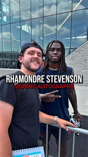 Krohn’s Captures on Instagram: "I met New England Patriots running back Rhamondre Stevenson! He was really cool and autographed two football cards for me—one Panini Prizm rookie card and one Absolute Football base card. What made it even better was that he also took a picture with me. He’s a great dude, and I’m really glad to have his autograph in my collection! . Which football card do you like better?"